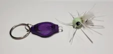 UV Light keychain charging a glow-in-the-dark BreamBugs popper